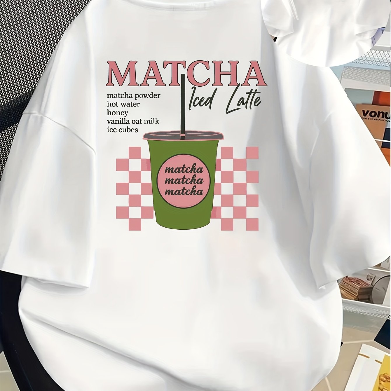 [Trendy, Matcha Lover Tee] Trendy Casual Tee - Women's Matcha Lover Graphic Tee | Light Pink with Green & White Checkered Design, "Matcha Powder Hot Water Vanilla Oat Milk Ice Cubes" Print, Casual Short Sleeve Crew Neck, Perf