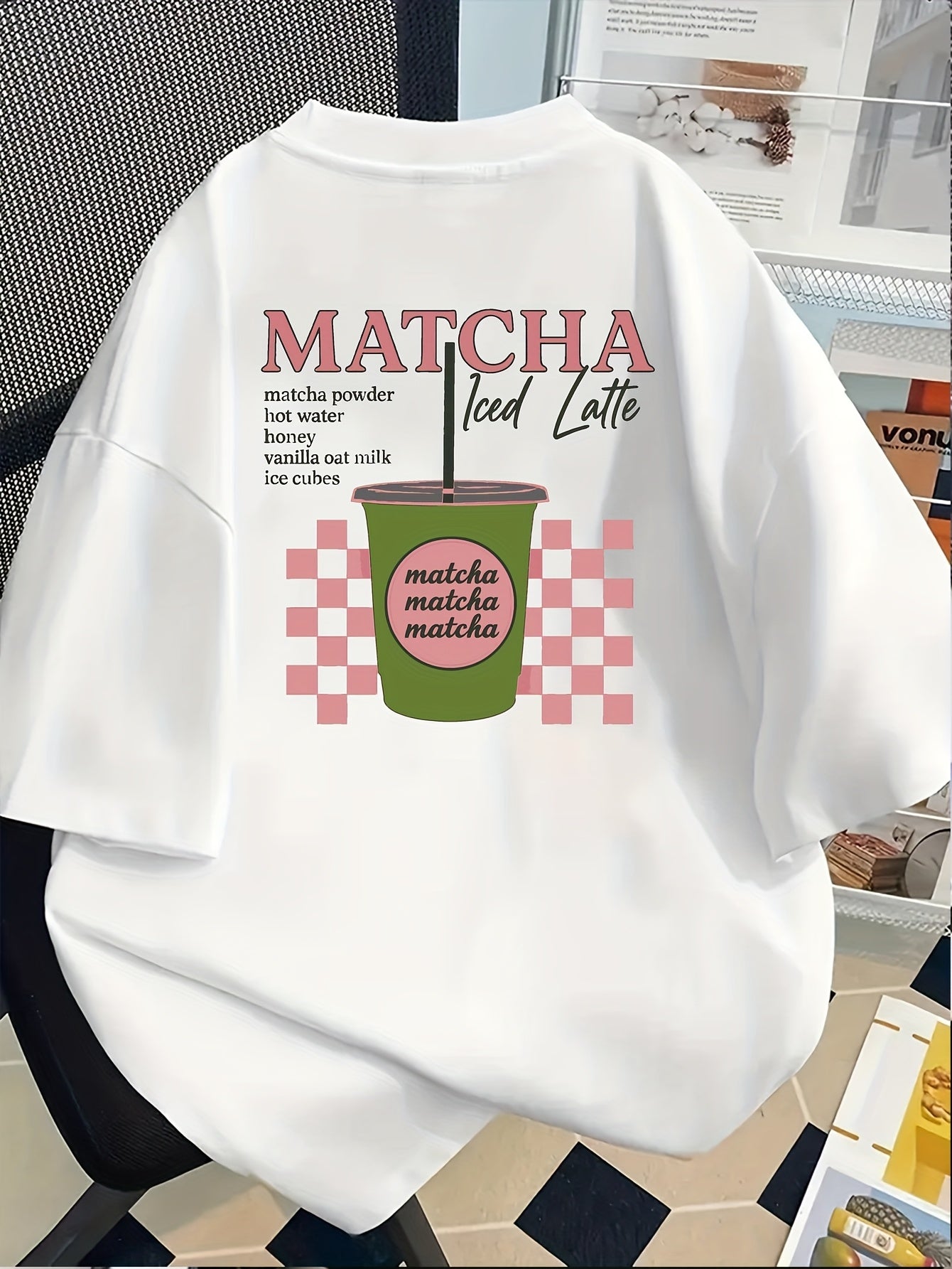 [Trendy, Matcha Lover Tee] Trendy Casual Tee - Women's Matcha Lover Graphic Tee | Light Pink with Green & White Checkered Design, "Matcha Powder Hot Water Vanilla Oat Milk Ice Cubes" Print, Casual Short Sleeve Crew Neck, Perf