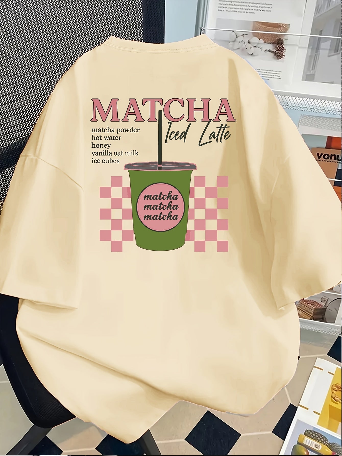 [Trendy, Matcha Lover Tee] Trendy Casual Tee - Women's Matcha Lover Graphic Tee | Light Pink with Green & White Checkered Design, "Matcha Powder Hot Water Vanilla Oat Milk Ice Cubes" Print, Casual Short Sleeve Crew Neck, Perf