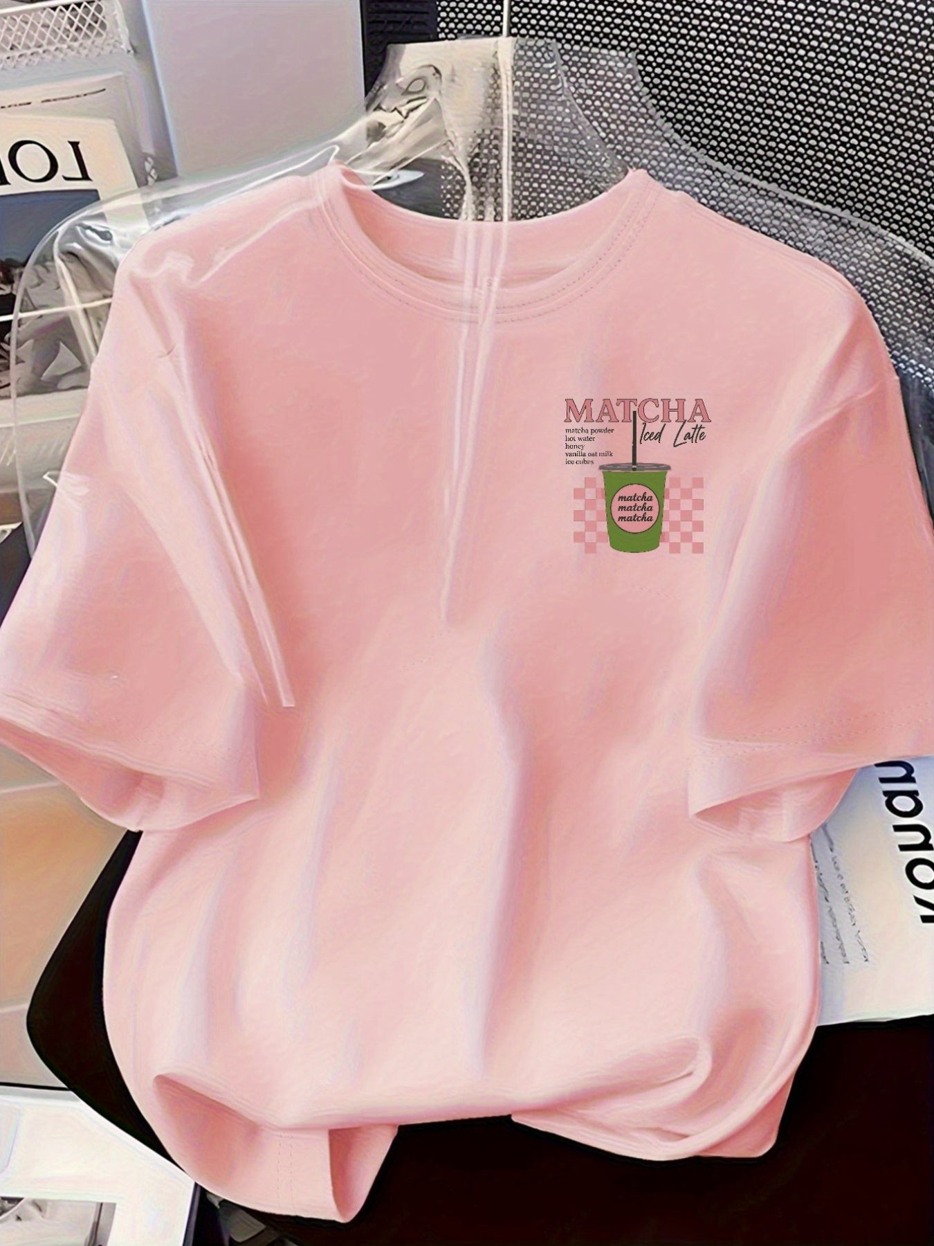 [Trendy, Matcha Lover Tee] Trendy Casual Tee - Women's Matcha Lover Graphic Tee | Light Pink with Green & White Checkered Design, "Matcha Powder Hot Water Vanilla Oat Milk Ice Cubes" Print, Casual Short Sleeve Crew Neck, Perf